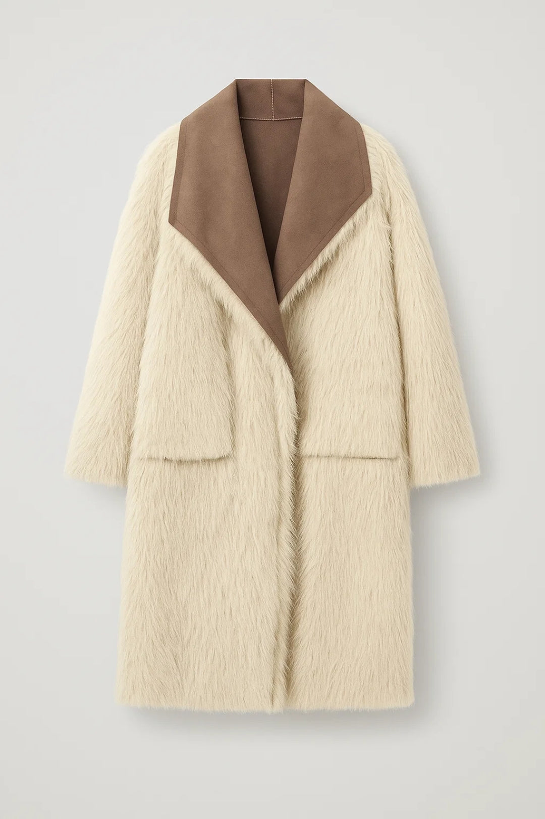 Lange Damesjas | Contrasterende Revers | Warmte en Luxe Gecombineerd